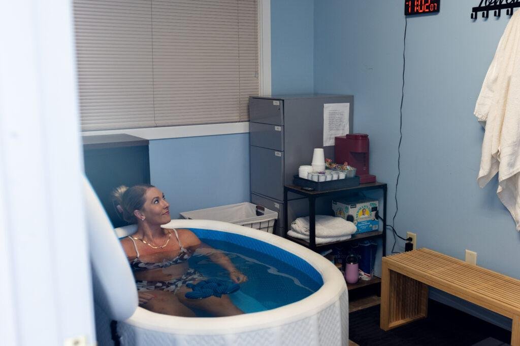 Woman relaxing in small indoor ice bath