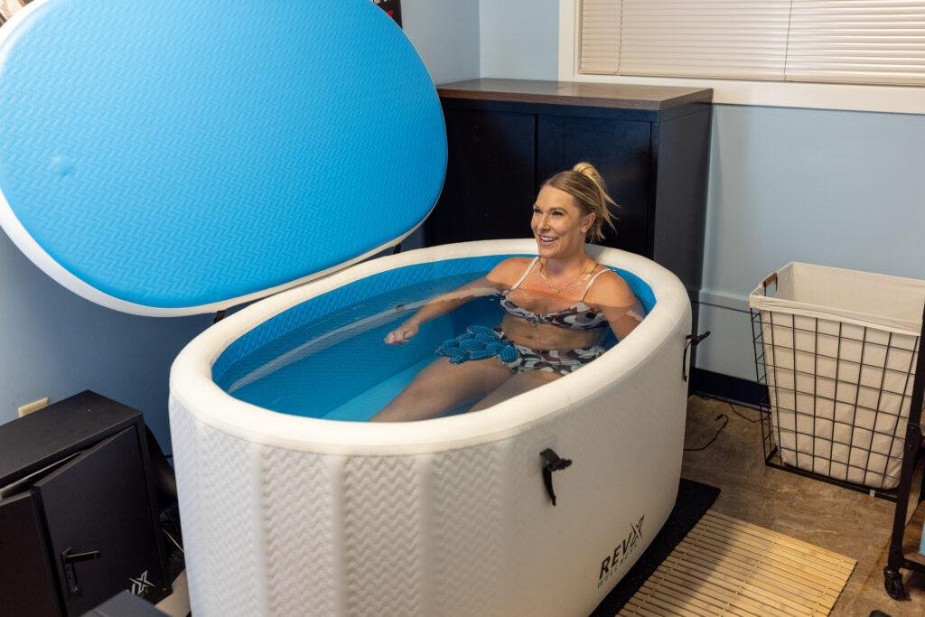 Woman relaxing in an inflatable ice bath tub