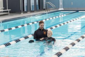 Physical therapist and patient performing aquatic therapy.